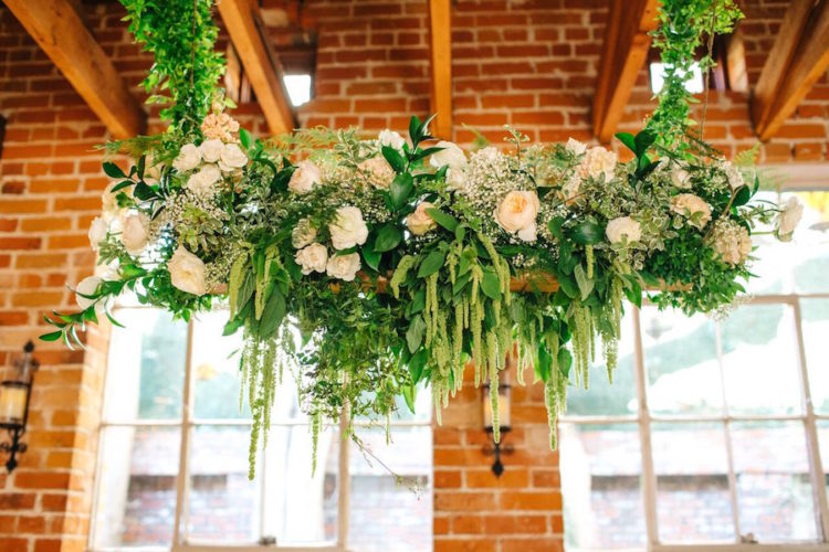 Lush floral and greenery hangings with blush peonies decorated the whole venue and created a refined atmosphere
