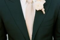 02 a black suit, a blush tie and an ivory shirt and boutonniere