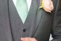 02 a peach boutonniere and a mint tie for the groom