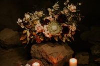 03 Artificial skulls, candles and moody florals created a mood for the shoot
