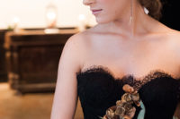 03 The bridal look was stunning, with a black lace dress, a silver crown and earrings, a bold bouquet
