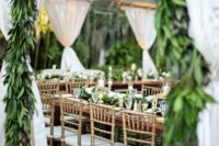 03 a wedding tent with greenery garlands all over