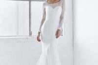 05 With an elegant illusion neckline, long sleeves, and fitted trumpet skirt in delicate ivory lace, the soft, ethereal elegance of the Milla Dress is both sexy and sweet