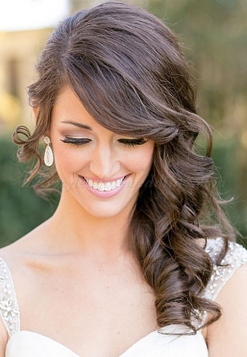 wavy side-swept hair with a bang is a chic and stylish idea that will fit most of formal bridal looks