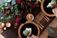 06 Dark chargers and gold details together with bold florals are a recipe for a bold tablescape