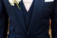 06 a navy suit with a blush tie and ivory flowers
