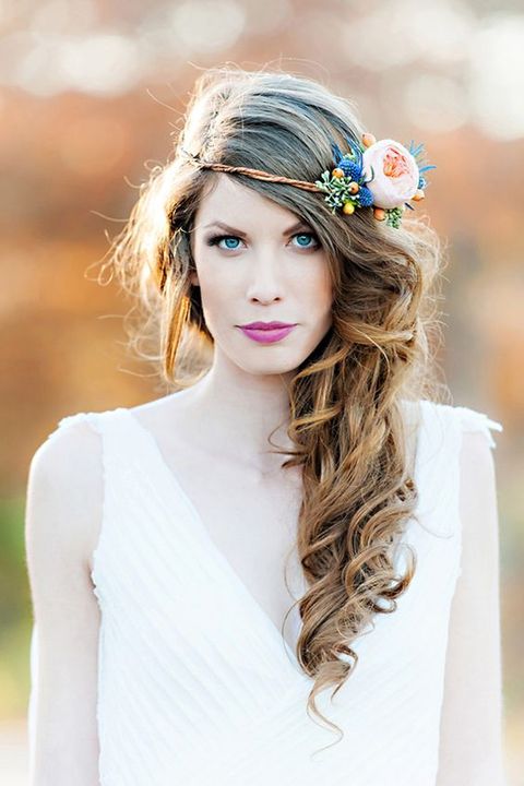 your side swept curls can be easily topped with a fresh flower crown, such a hairstyle looks very romantic
