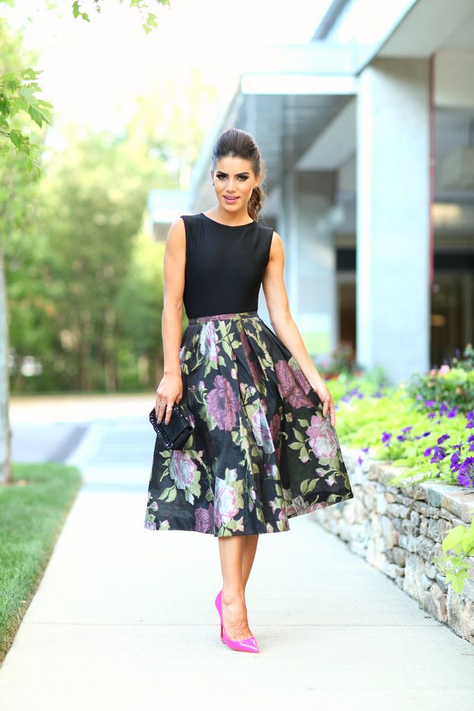 a floral midi, a black top and fuchsia shoes
