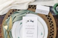 10 woven jute placemat, an olive green napkin and gold tableware for rustic elegance