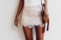 11 a lace mini, a white V-neck top and lace up heels