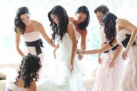 11 blush ruffled dresses with black sashes and bows