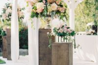 11 blush-toned ceremony spot decorated with lots of flowers
