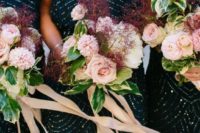 11 navy sequined bridesmaid dresses and carried blush wedding bouquets with maroon accents