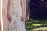 11 nude gown with white lace appliques and a mermaid silhouette