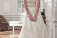 11 romantic lace and tulle A-line wedding dress with an embellished sash