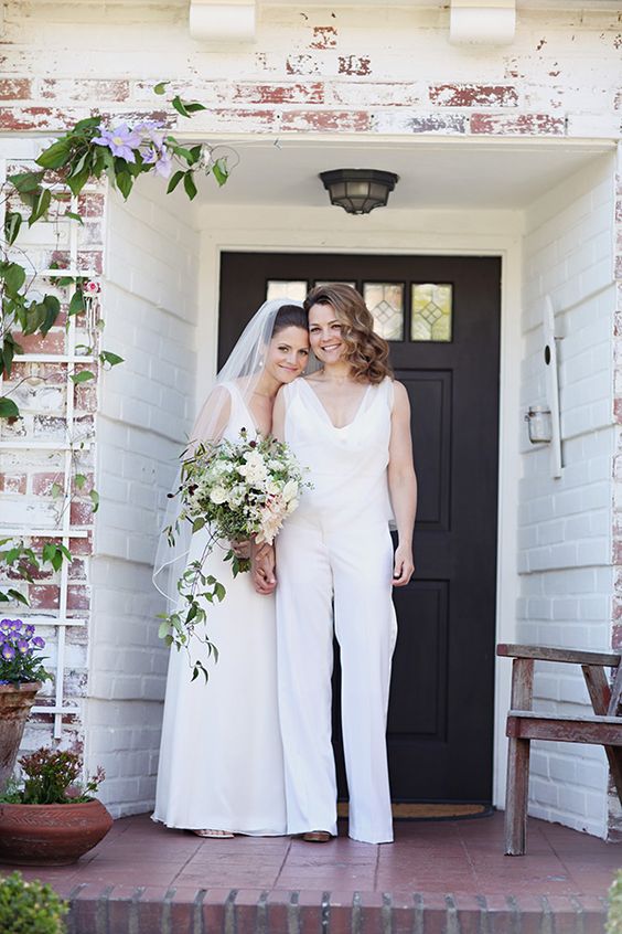 a white jumpsuit and a modern wedding ballgown with a veil are a great couple look that inspires