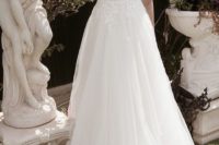 12 airy gown with a lace bodice and wide illusion straps