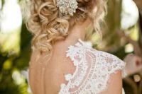 12 messy curled updo wwith a chic vintage jewel