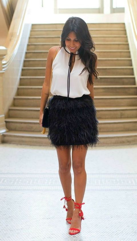 black feather mini, a white top and red heels to make a statement