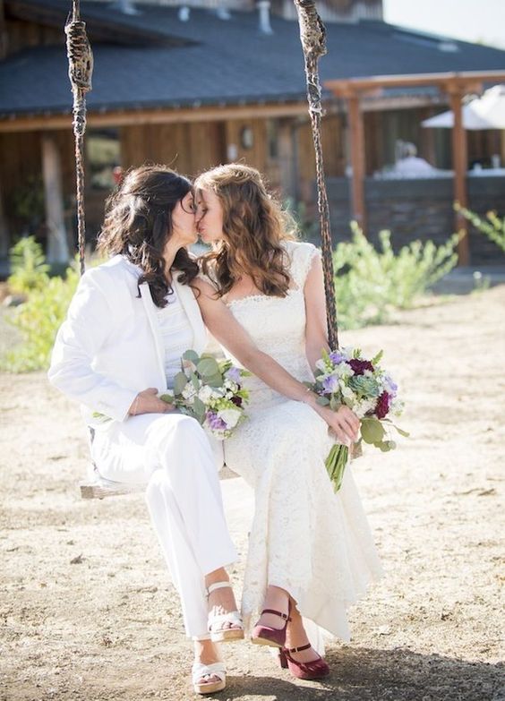 an elegant ivory pantsuit and shirt, heels, a lace mermaid wedding dress with thick straps and red heels for a chic couple look