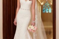 14 lace over rich dolce satin slim A-line bridal gown with a chapel train