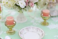 14 mint tablecloth with white lace, peach candles and flowers
