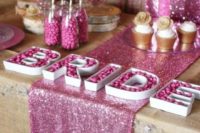 14 pink and gold candy table with a glitter runner