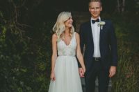 15 ivory strap wedding dress with a light skirt and a floral applique bodice