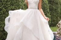 16 a wedding dress with a lace bodice and a dotted A-line skirt