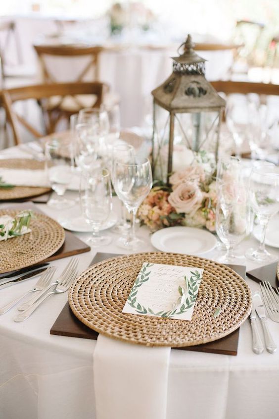 a wooden plank and a jute placemat, white textiles and cute flowers