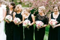 17 bridesmaids in black with blush bouquets