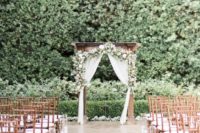 17 outdoor garden ceremony spot and aisle with greenery and flowers