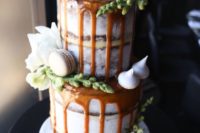 17 salted caramel drip cake topped wwith macarons and blooms