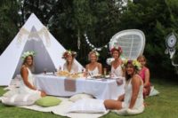 19 boho shower table can be placed right on the grass for a summer picnic, add a teepee