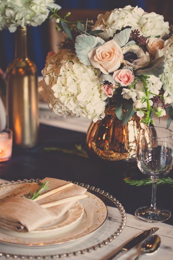 a navy table runner, blush roses and gold touches for a chic tablescape