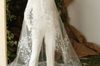 cropped ivory pants and a shirt, white floral heels and a long veil with lace applique create a bold and chic modern bridal look