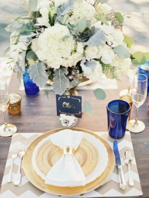 elegant chevron beige and white placemat, a gold charger and neutral florals