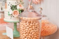 20 peach candies, flowers and paper decor, a mint cake stand