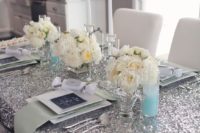 20 silver, ivory and mint table setting for a glam bridal shower