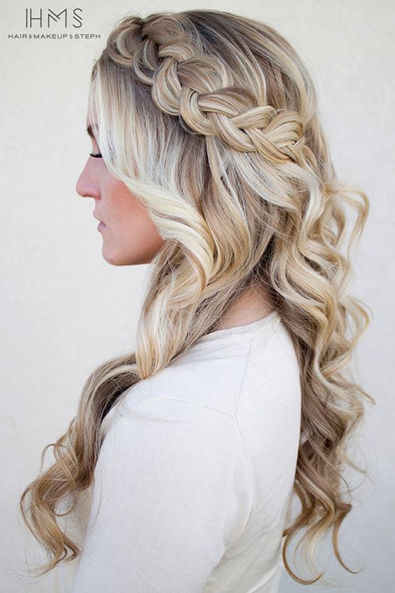 a chunky braid with loose curls