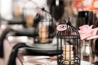 21 black and pink tablescape, black cages with blush macarons for favors