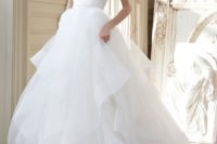 21 draped bodice and a layered tulle skirt make this dress look airy