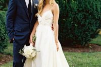21 effortlessly chic ivory wedding dress with spaghetti straps and floral detailing