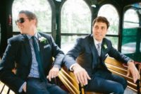 21 same navy suits, a shirt that matches the other groom’s tie