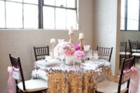 21 silver and pink table setting with pink flowers