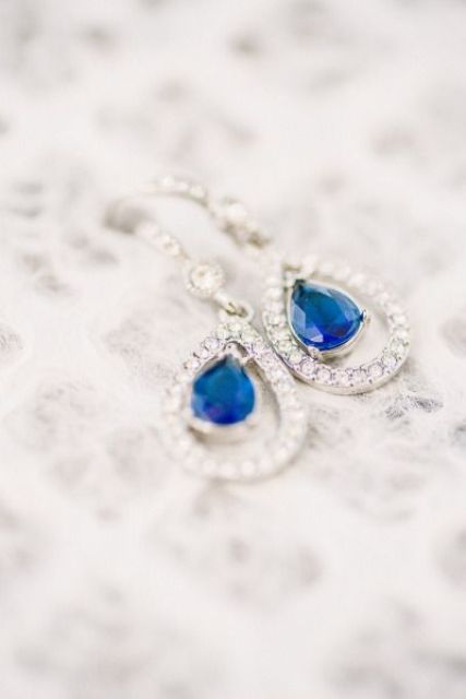 stylish earrings with blue stones inside