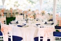 22 navy chairs and napkins, blush bows and flowers