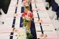 24 a striped navy table runner and blush napkins