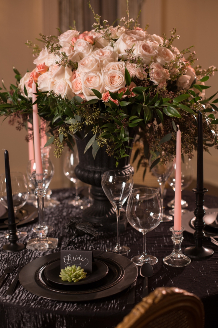 dramatic black table decor with blush blooms and candles