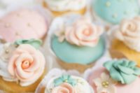 26 cupcakes with mint and peach flower frosting